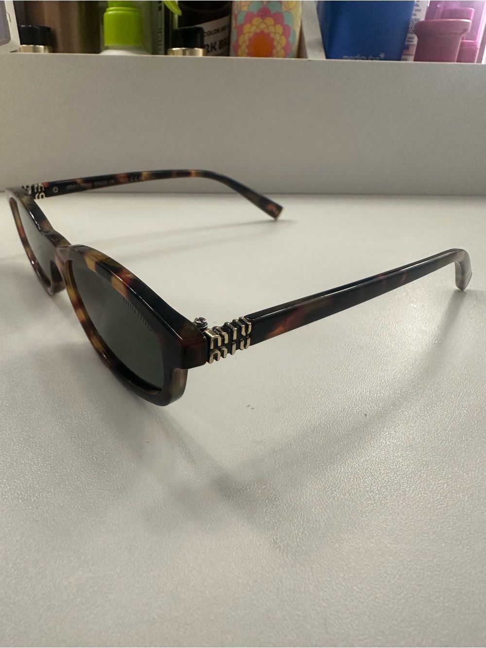 Miu Miu Tortoiseshell Sunglasses with Gold Temple Detail